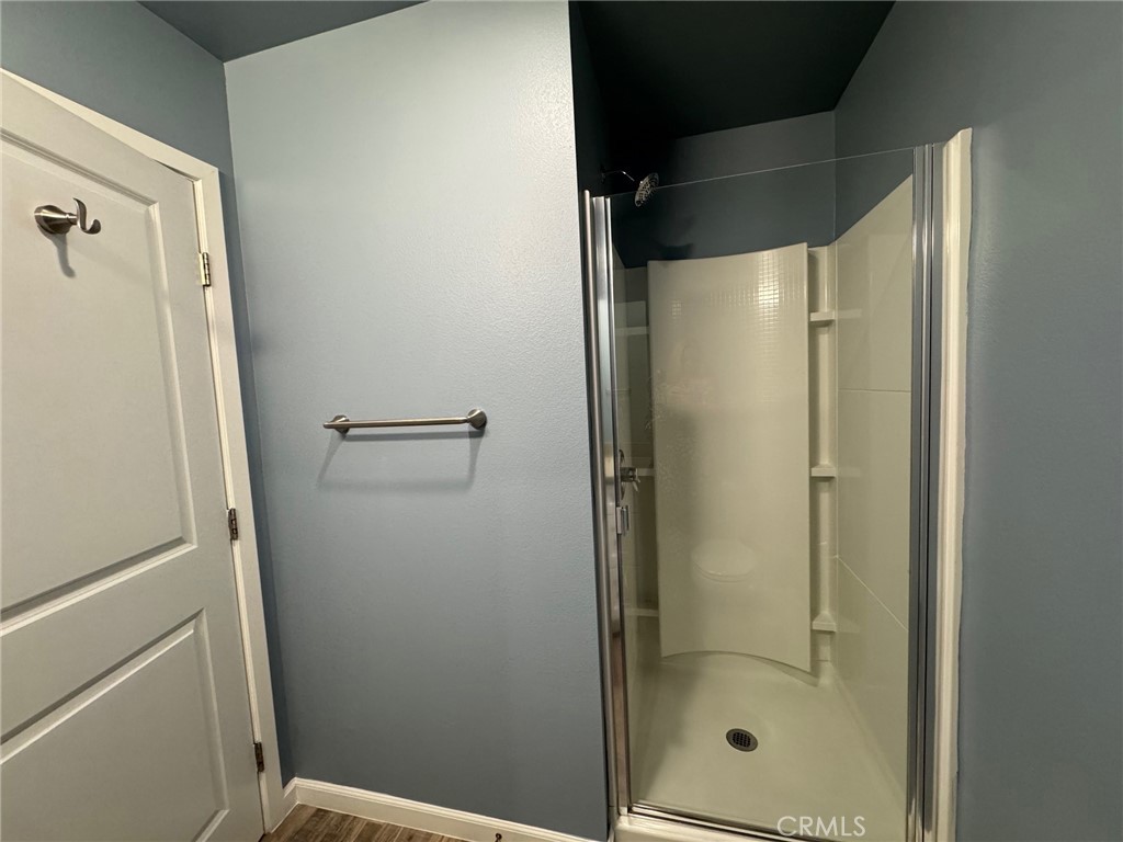 623 Normandie Avenue Los Angeles, CA 90004 - Photo 7 of 23 a bathroom with a glass shower door