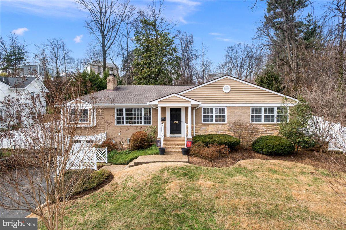 3012 Russell Road Alexandria, VA 22305 - Photo 2 of 56 a front view of a house with a yard
