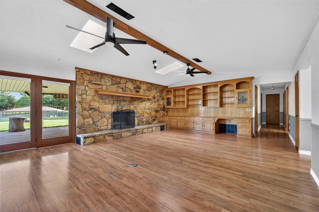 106 Snyder Ranch Road Trinidad, TX 75163 - Photo 11 of 40 Living room with massive stone wood-burning fireplace and lots of built-ins