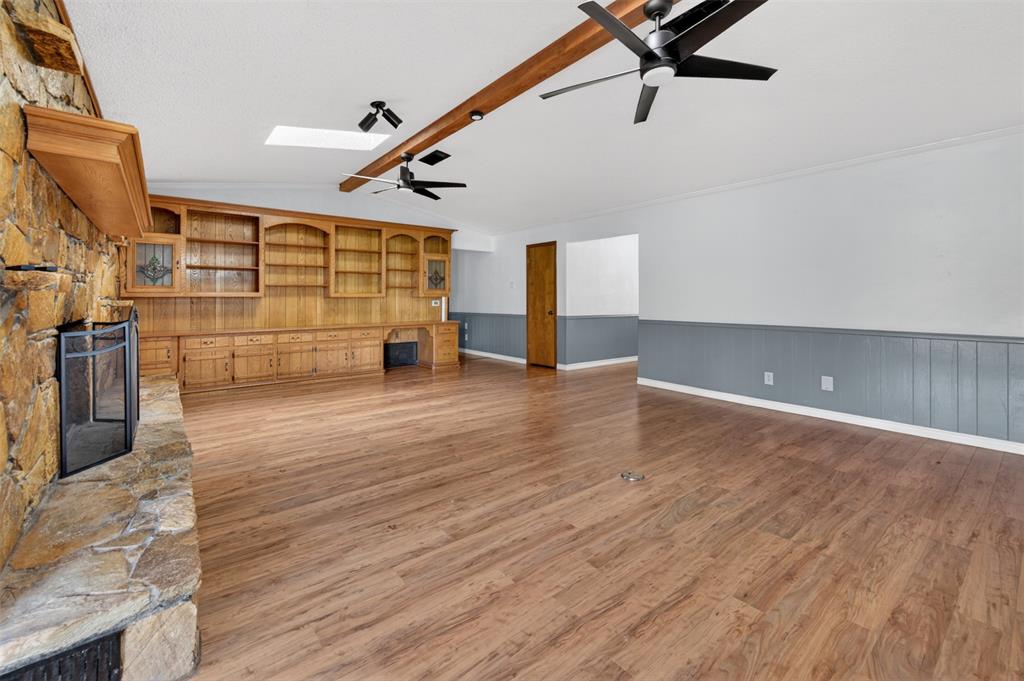 106 Snyder Ranch Road Trinidad, TX 75163 - Photo 13 of 40 Living room with massive stone wood-burning fireplace and lots of built-ins