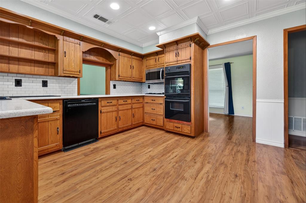 106 Snyder Ranch Road Trinidad, TX 75163 - Photo 15 of 40 The kitchen is at the heart of the home and has lots of counter space and tons of cabinets plus newer appliances and double ovens