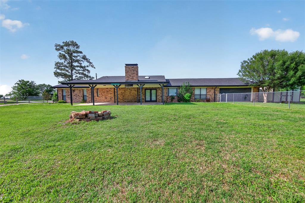 106 Snyder Ranch Road Trinidad, TX 75163 - Photo 37 of 40 Massive backyard with covered patio and fire pit