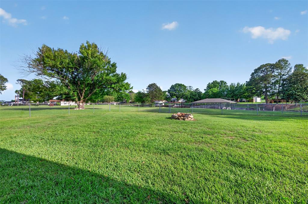 106 Snyder Ranch Road Trinidad, TX 75163 - Photo 39 of 40 Massive backyard with covered patio and fire pit