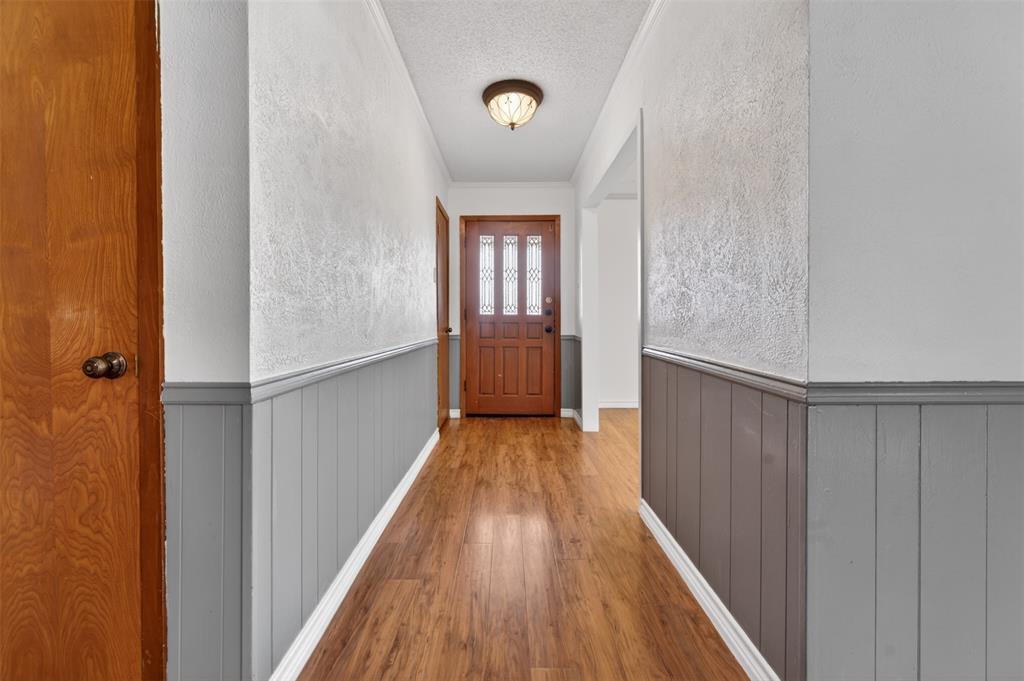 106 Snyder Ranch Road Trinidad, TX 75163 - Photo 7 of 40 View from the living room to the front door. The formal living/dining entrance can be seen on the right of the picture