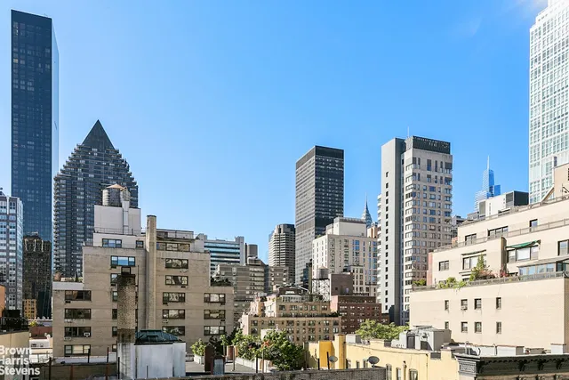a view of city with tall buildings
