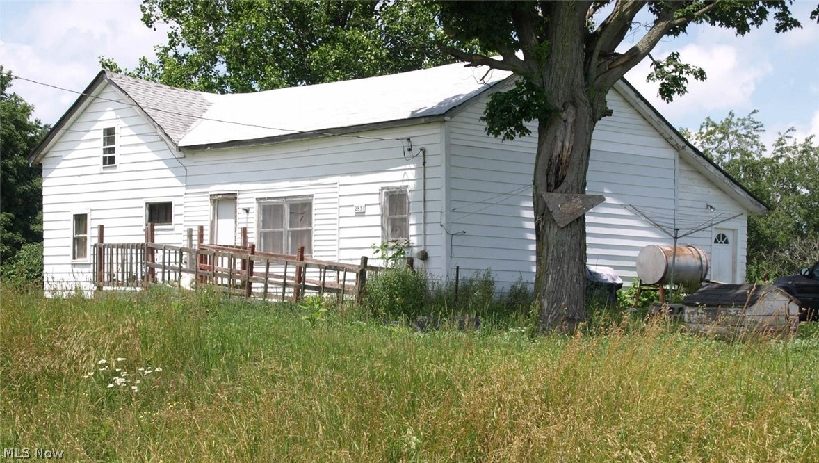 2831 South Denmark Road Jefferson, OH 44047 - Photo 1 of 18 Back of property featuring oil tank