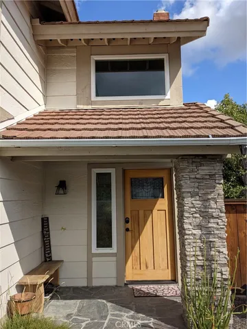 a view of a house with large windows