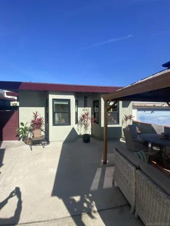 a front view of a house with outdoor space