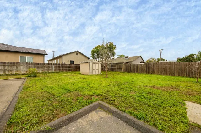 a backyard of a house with lots of green space