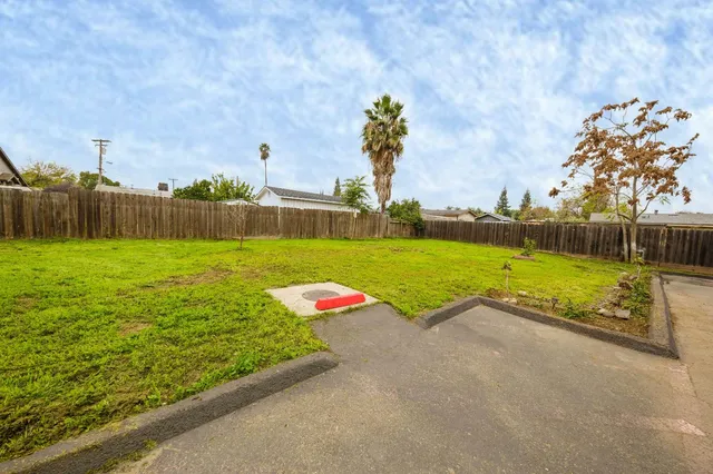 a view of a swimming pool with a yard