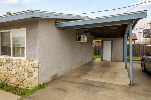 an aerial view of a house with a swimming pool
