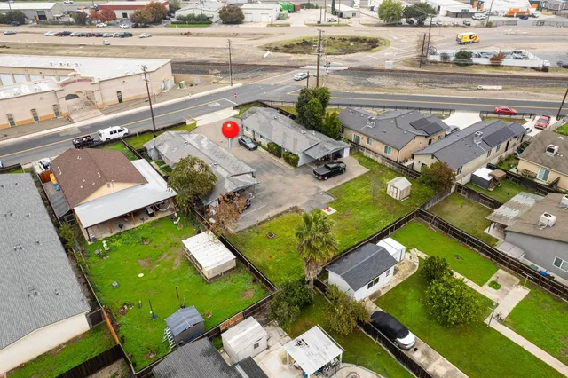 an aerial view of residential building and parking space