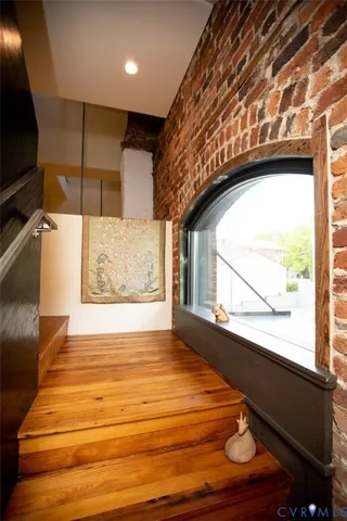 a view of balcony with wooden floor