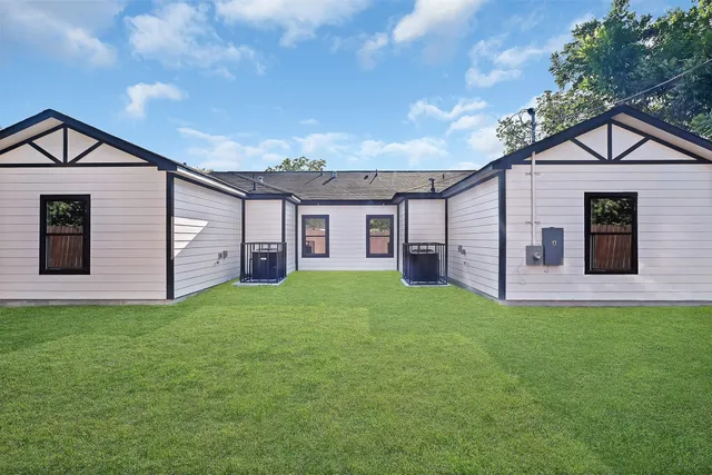a view of a backyard of the house