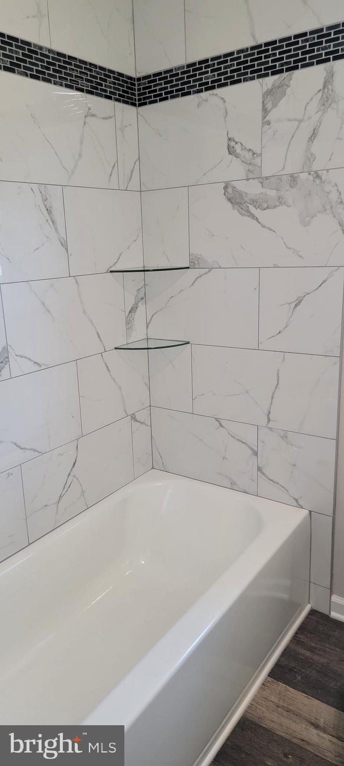 626 Cloverfield Lane Harrington, DE 19952 - Photo 16 of 22 Hall Bath tiled shower