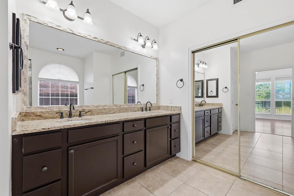 103 Ranch Trail Irving, TX 75063 - Photo 17 of 39 Ensuite has jetted garden tub with separate shower, dual sinks & granite tops.