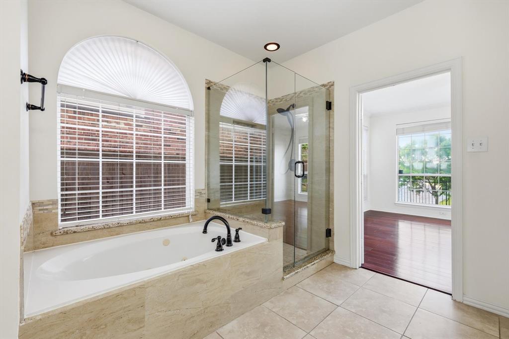 103 Ranch Trail Irving, TX 75063 - Photo 18 of 39 Ensuite has jetted garden tub with separate shower, dual sinks & granite tops.