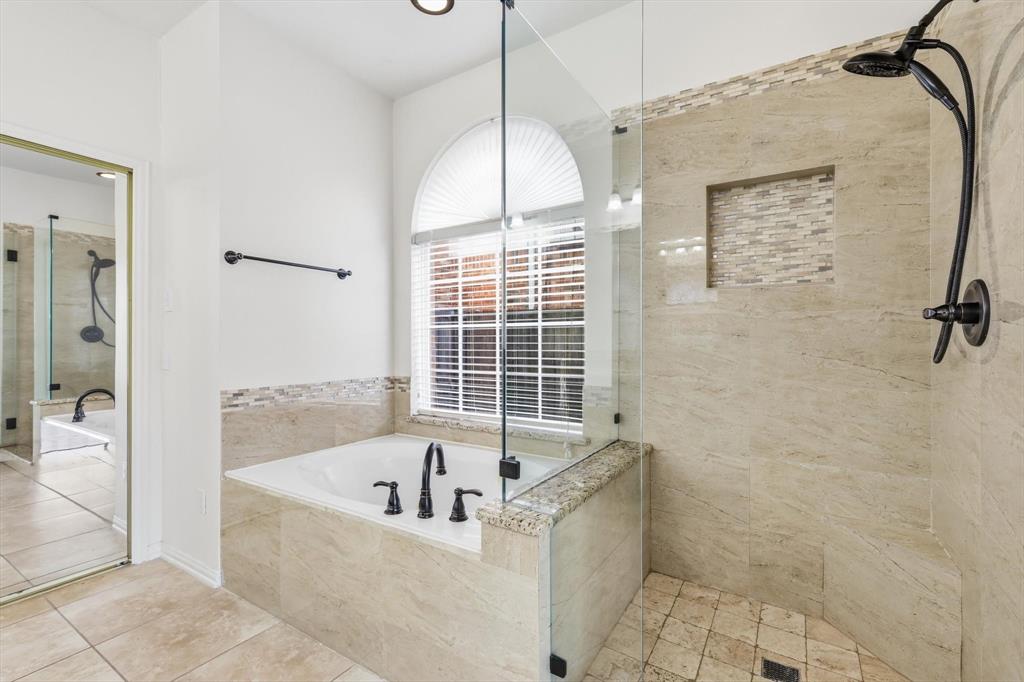103 Ranch Trail Irving, TX 75063 - Photo 19 of 39 Ensuite has jetted garden tub with separate shower, dual sinks & granite tops.