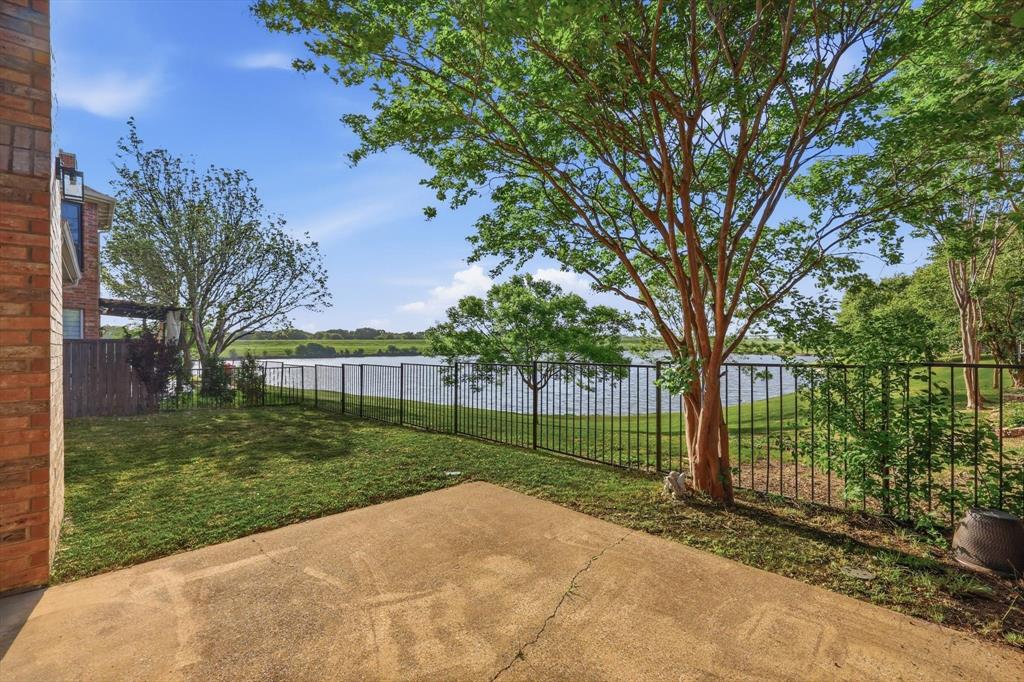 103 Ranch Trail Irving, TX 75063 - Photo 32 of 39 Back yard patio has awning and an amazing waterview.