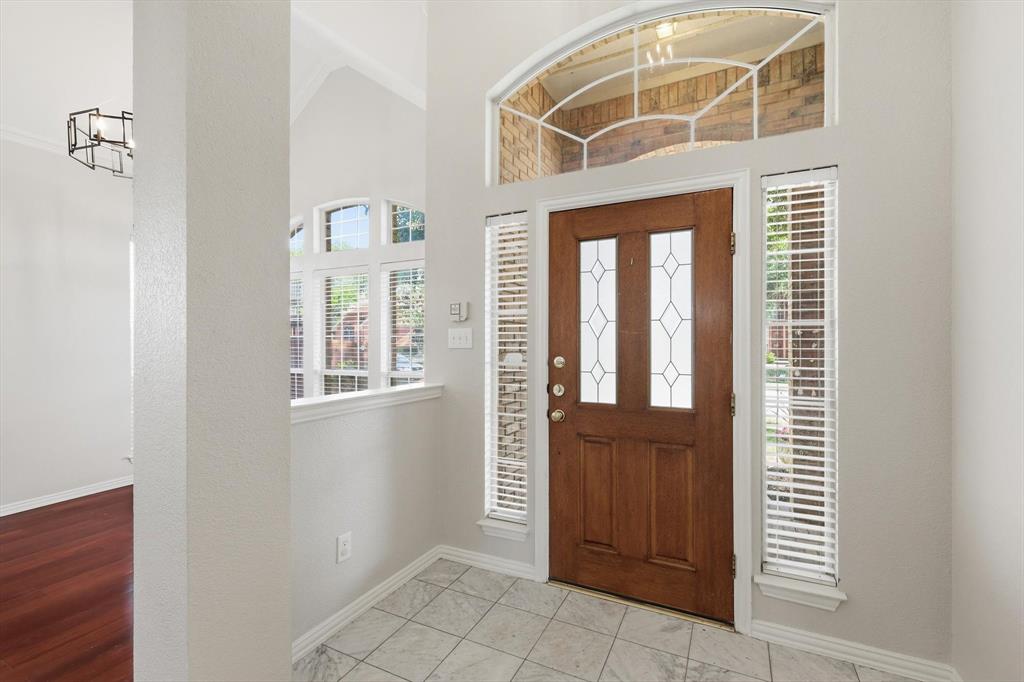 103 Ranch Trail Irving, TX 75063 - Photo 39 of 39 Elegance with an open floor plan. The dining room or 2nd liv. area is to the right of entry.