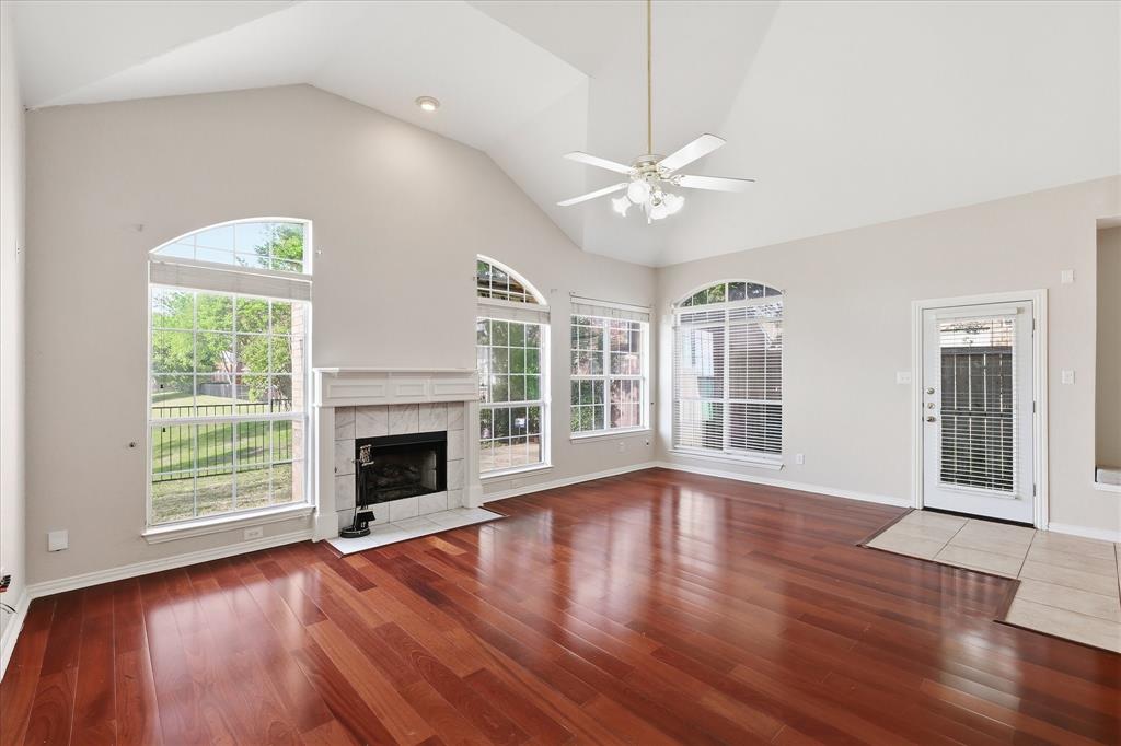 103 Ranch Trail Irving, TX 75063 - Photo 7 of 39 Open & light plan with high ceiling, pretty flooring, lots of natural light & view of the water