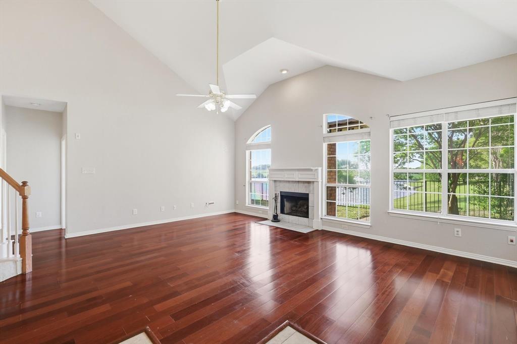 103 Ranch Trail Irving, TX 75063 - Photo 8 of 39 Open & light plan with high ceiling, pretty flooring, lots of natural light & view of the water