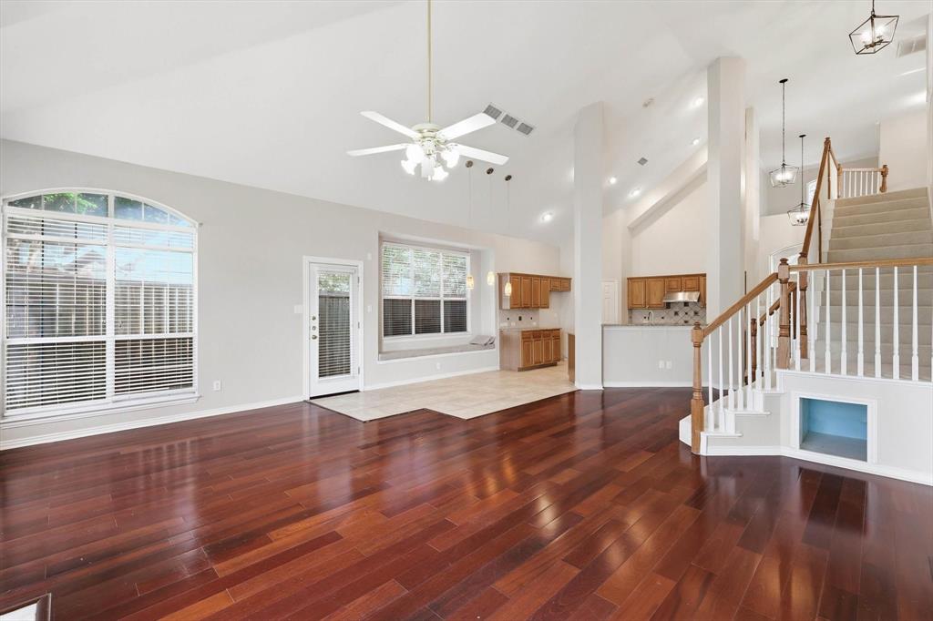 103 Ranch Trail Irving, TX 75063 - Photo 9 of 39 Open & light plan with high ceiling, pretty flooring, lots of natural light & view of the water