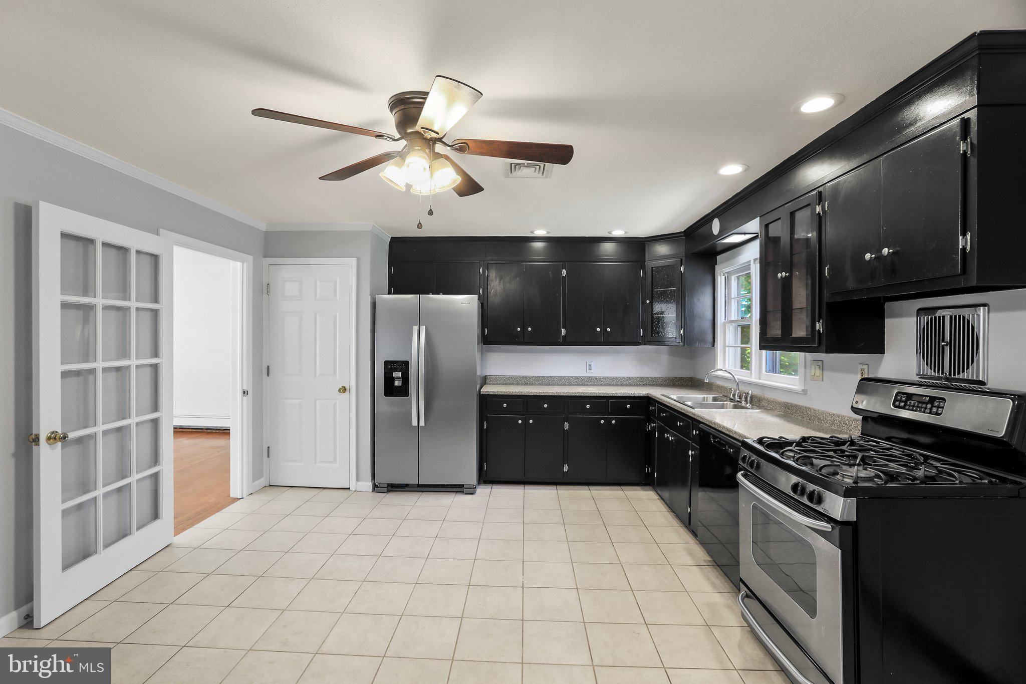 120 West Upper Ferry Road Ewing, NJ 08628 - Photo 11 of 27 a large kitchen with stainless steel appliances granite countertop a stove and a refrigerator