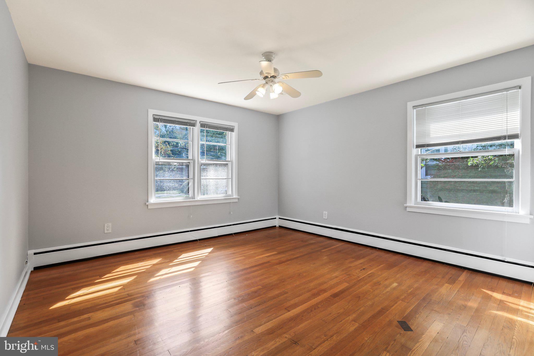120 West Upper Ferry Road Ewing, NJ 08628 - Photo 15 of 27 wooden floor in an empty room with a window