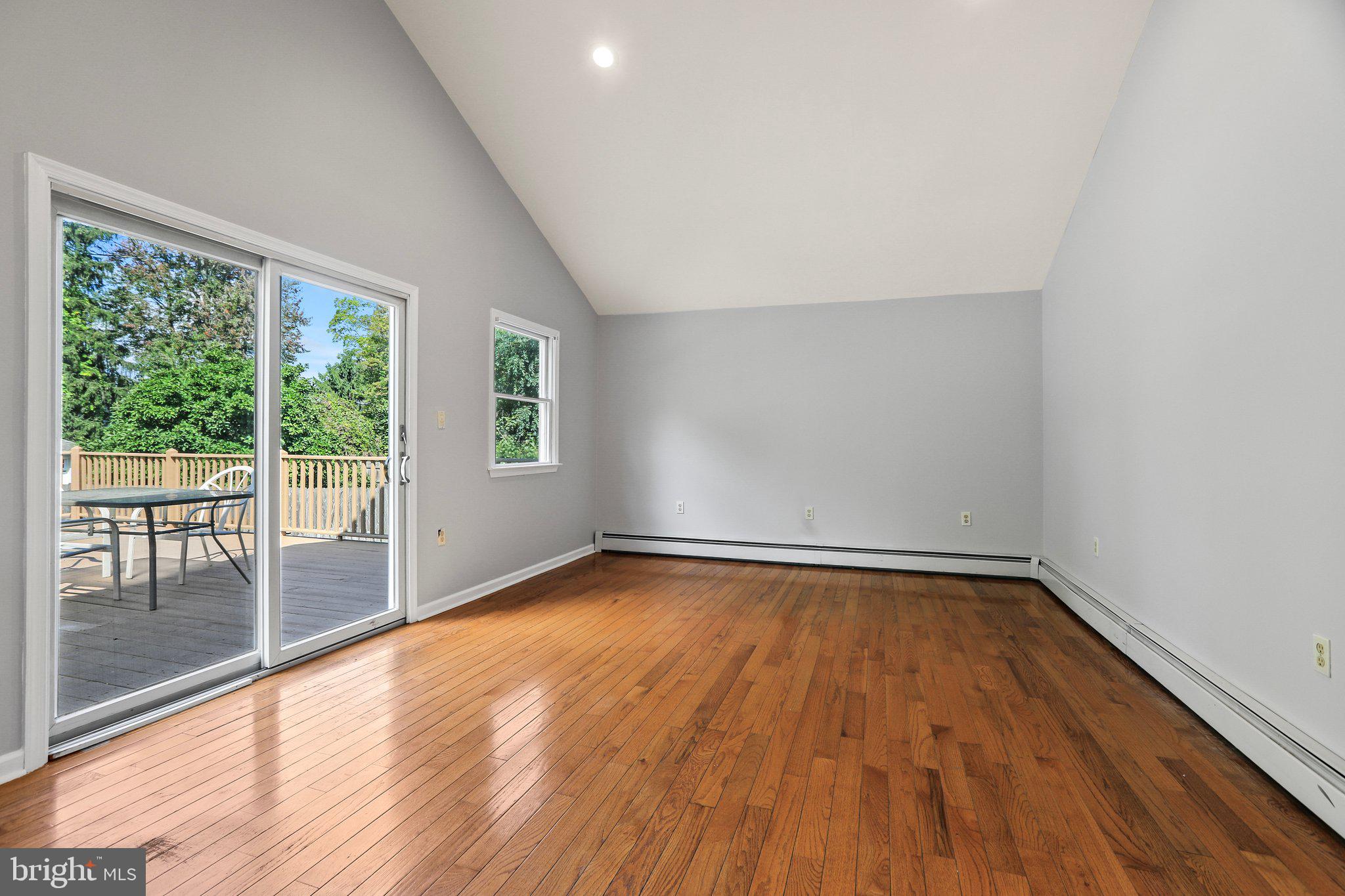 120 West Upper Ferry Road Ewing, NJ 08628 - Photo 16 of 27 an empty room with wooden floor and windows