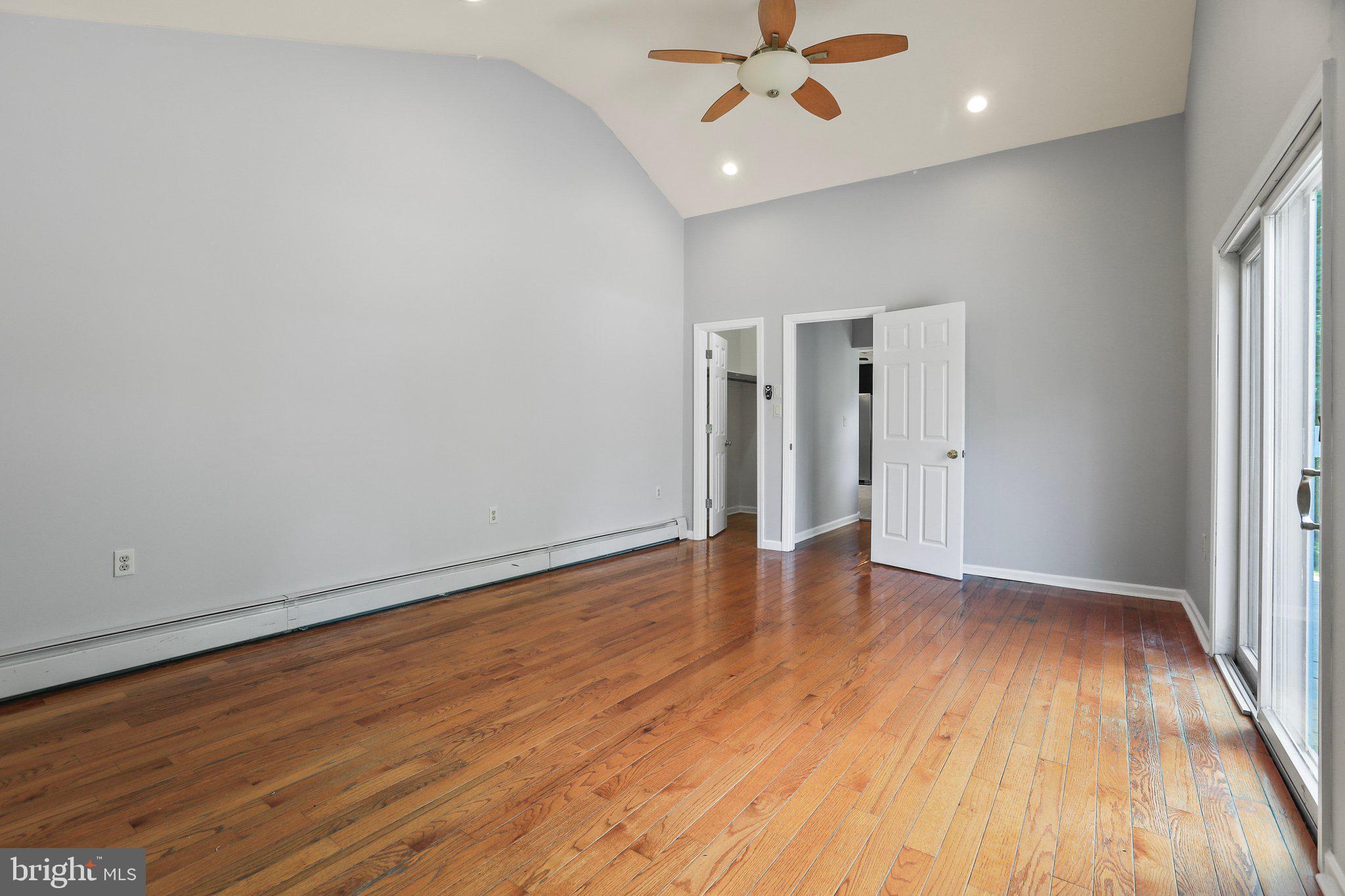 120 West Upper Ferry Road Ewing, NJ 08628 - Photo 17 of 27 an empty room with wooden floor and windows