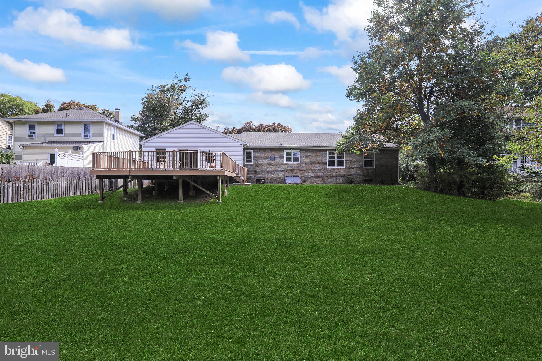 120 West Upper Ferry Road Ewing, NJ 08628 - Photo 23 of 27 a view of a house with a big yard and a large tree