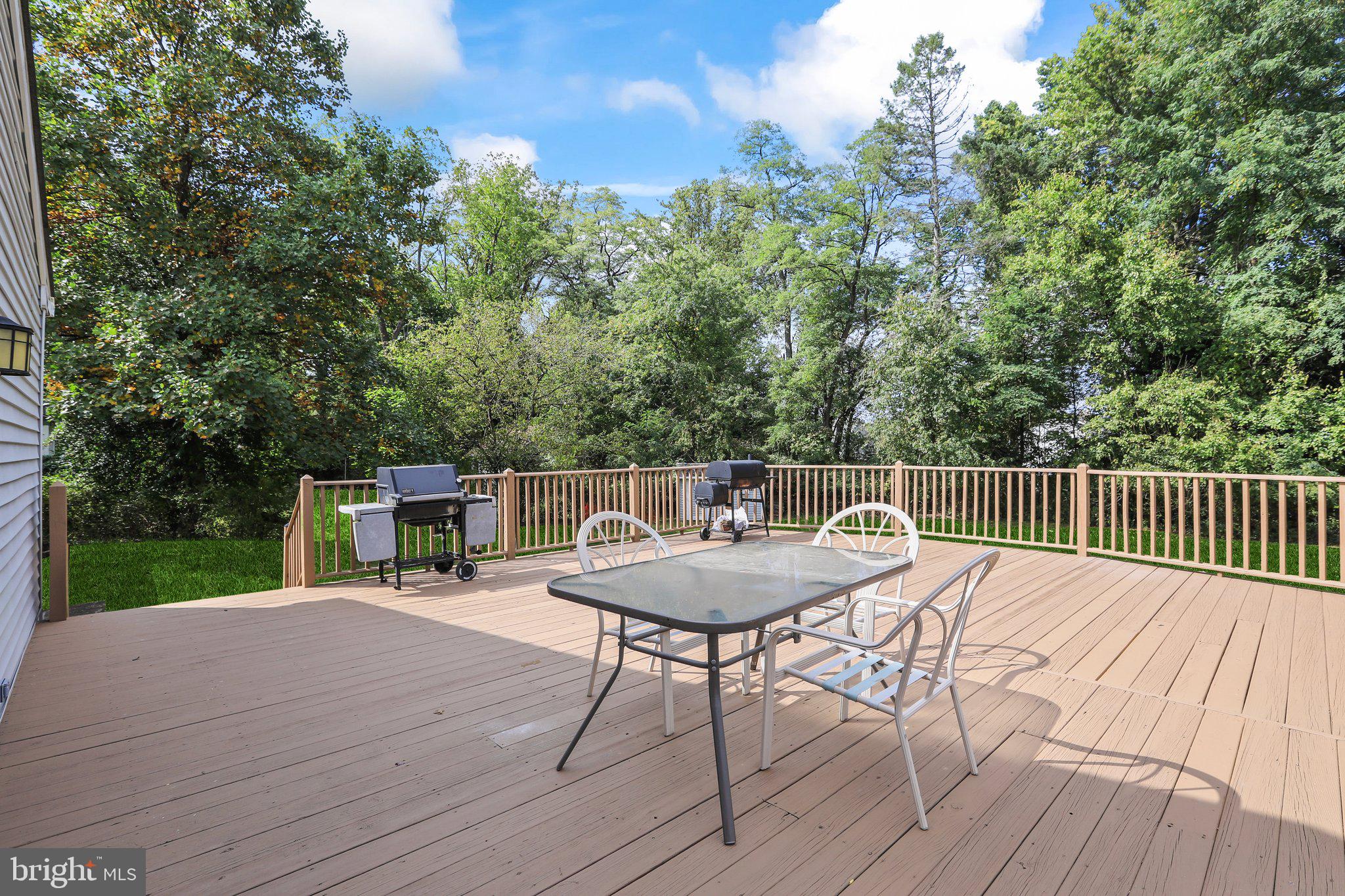 120 West Upper Ferry Road Ewing, NJ 08628 - Photo 27 of 27 a balcony with wooden floor table and chairs