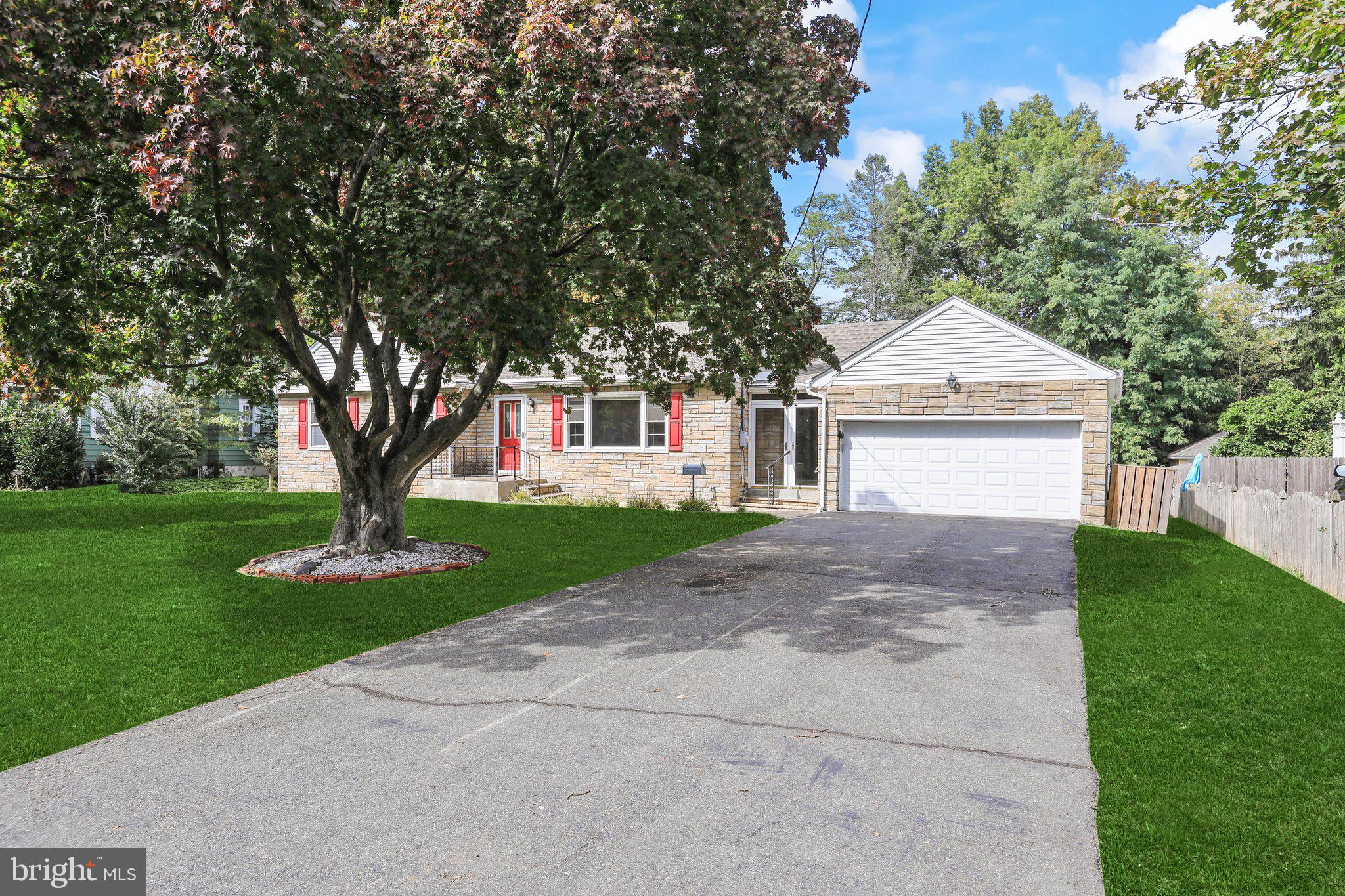 120 West Upper Ferry Road Ewing, NJ 08628 - Photo 3 of 27 a front view of a house with a garden and trees