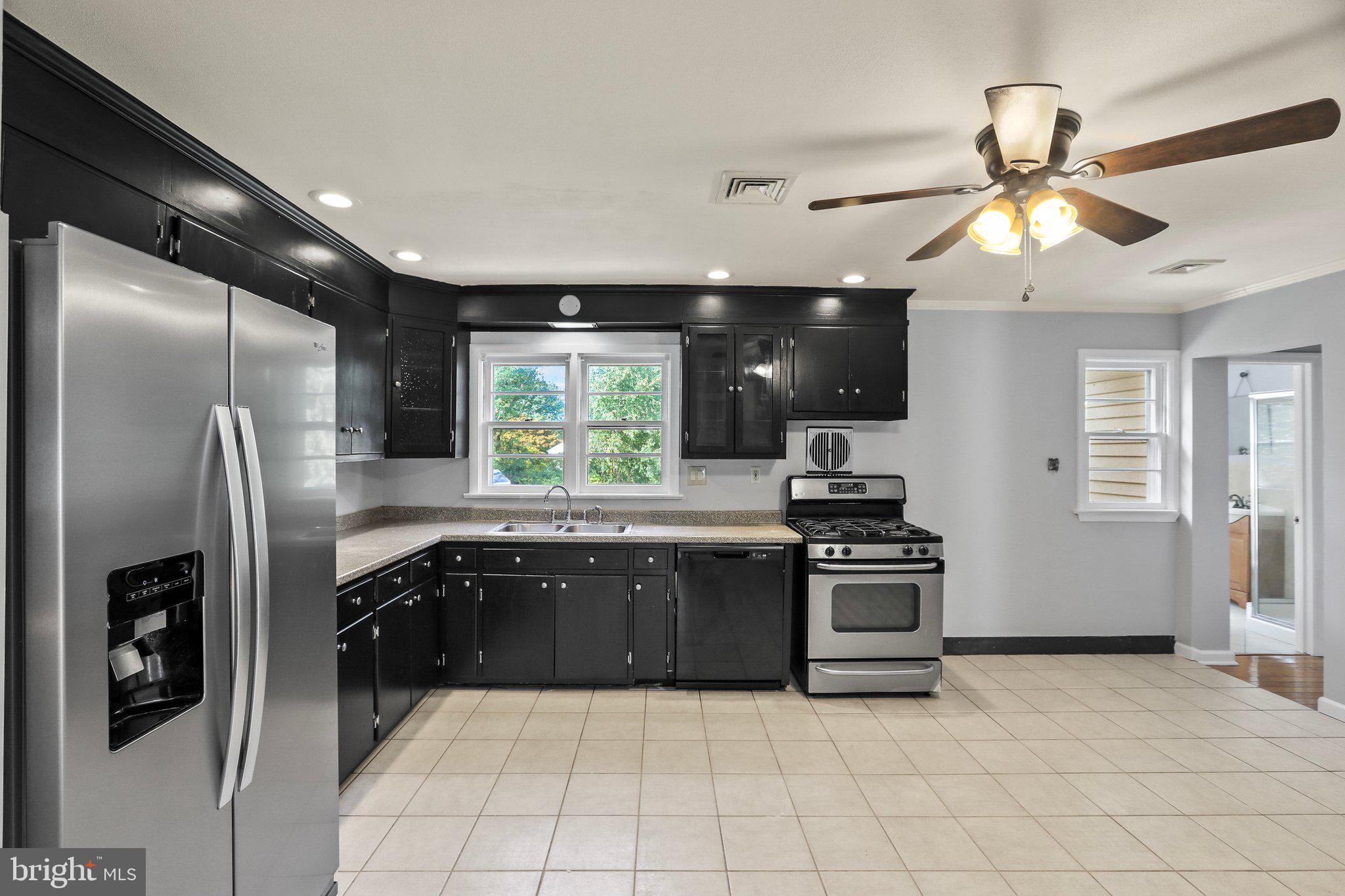 120 West Upper Ferry Road Ewing, NJ 08628 - Photo 9 of 27 a kitchen with stainless steel appliances granite countertop a refrigerator a sink a stove and dishwasher