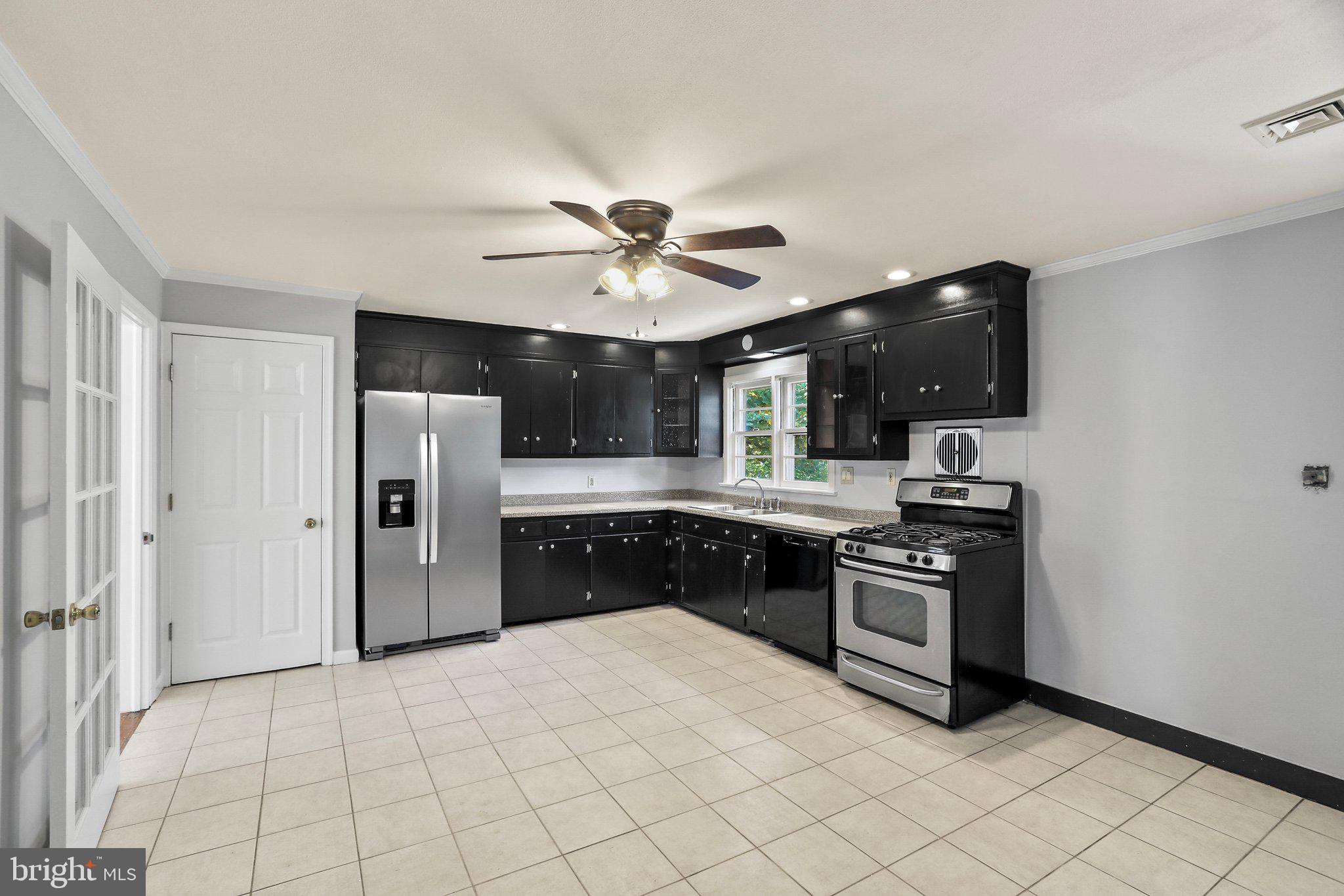 120 West Upper Ferry Road Ewing, NJ 08628 - Photo 10 of 27 a kitchen with stainless steel appliances a stove a refrigerator and a sink