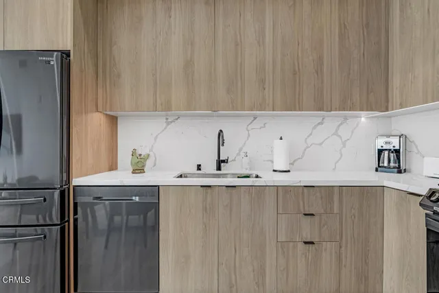 a kitchen with a sink and cabinets