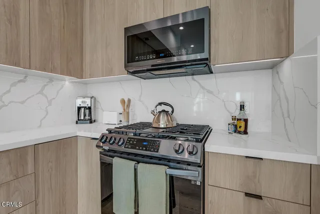 a kitchen with a stove and a microwave