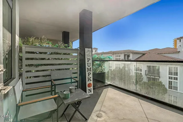 a view of a balcony with chairs