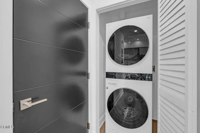 a view of a hallway with washer and dryer