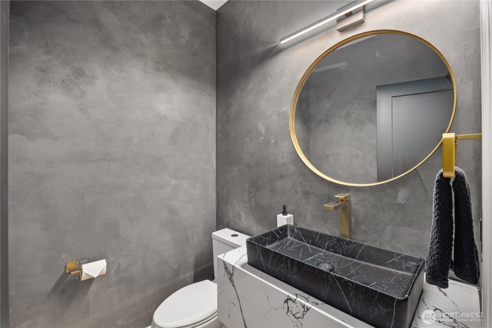 11127 Northeast 162nd Street Bothell, WA 98011 - Photo 13 of 40 a bathroom with a sink mirror vanity and toilet