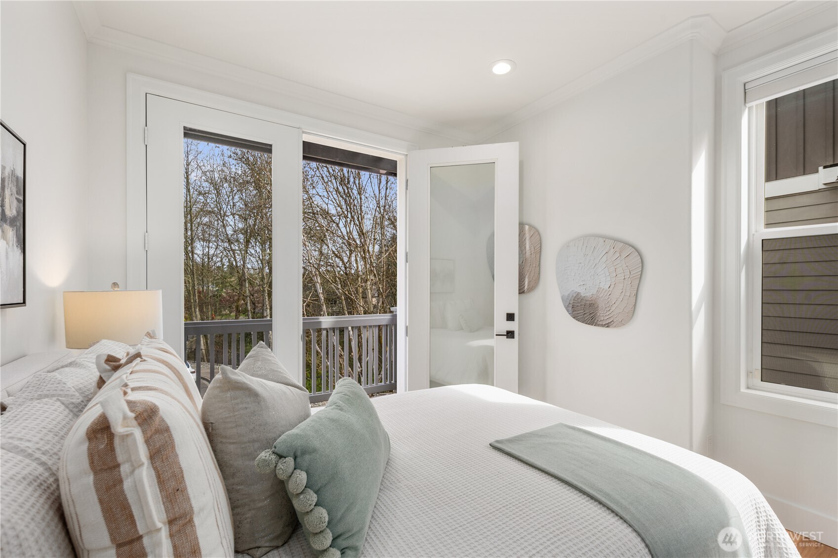 11127 Northeast 162nd Street Bothell, WA 98011 - Photo 14 of 40 a bedroom with a large bed and a window