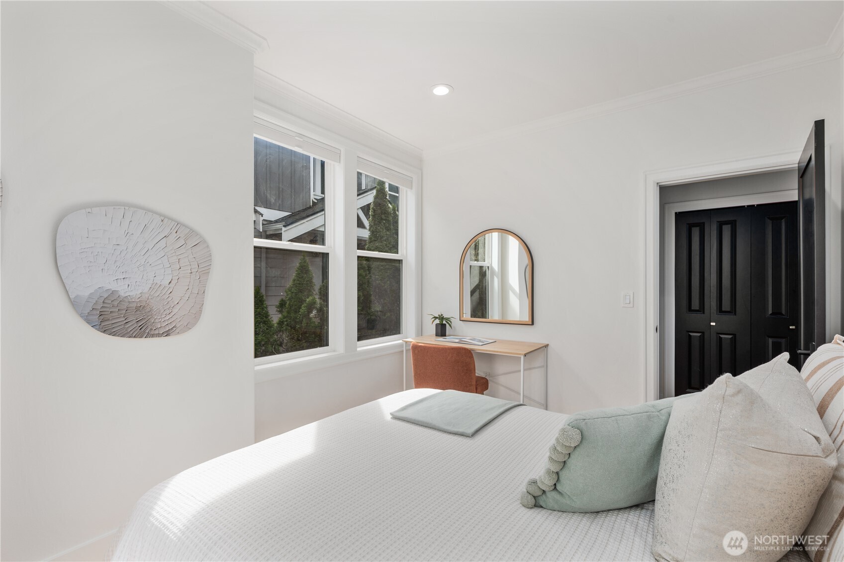 11127 Northeast 162nd Street Bothell, WA 98011 - Photo 15 of 40 a bedroom with a large bed and a large window