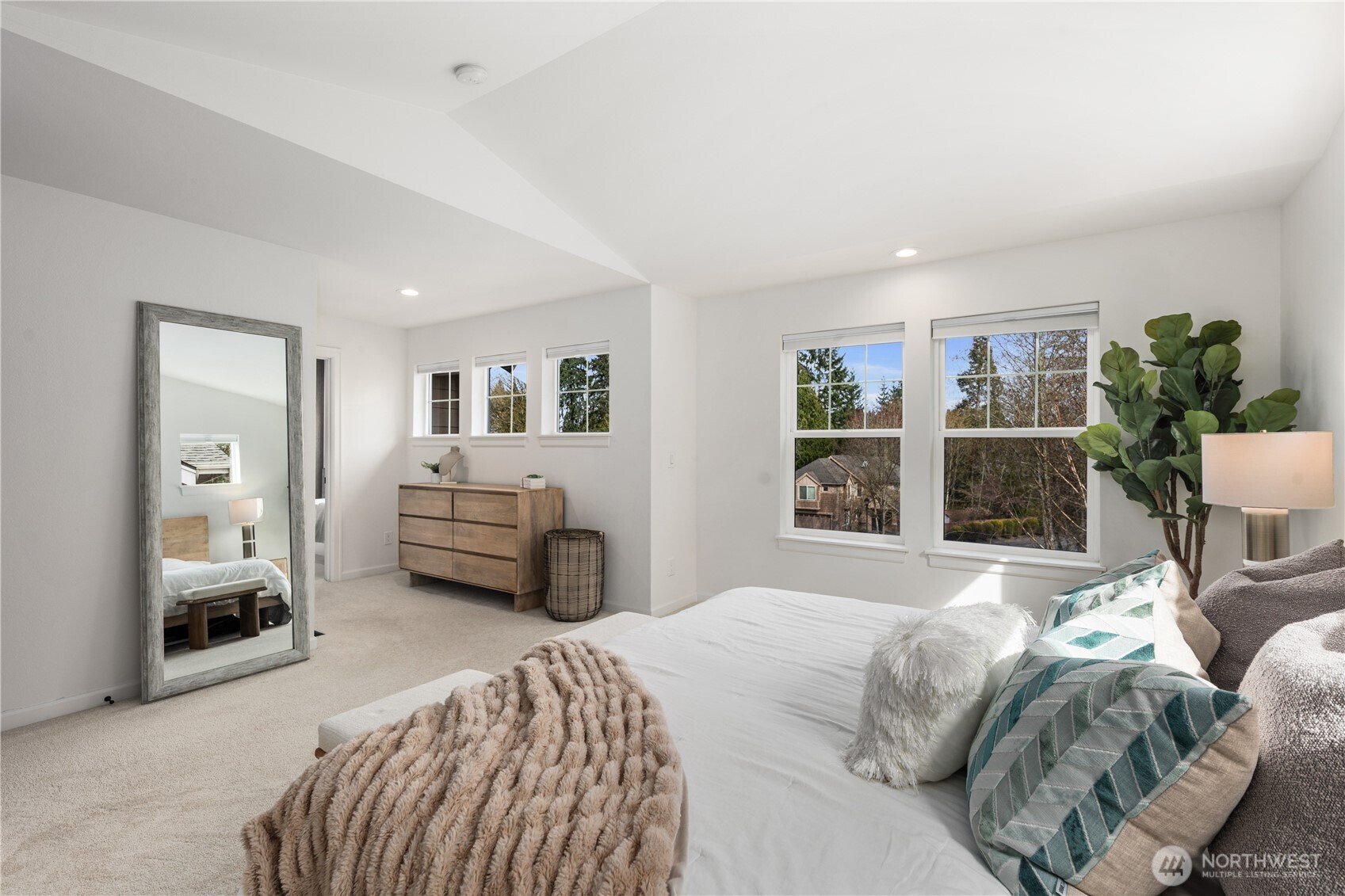 11127 Northeast 162nd Street Bothell, WA 98011 - Photo 21 of 40 a bedroom with a bed and a large window