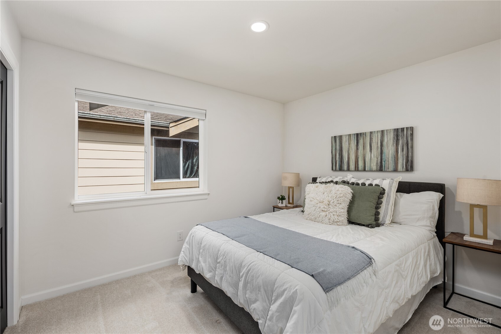 11127 Northeast 162nd Street Bothell, WA 98011 - Photo 26 of 40 a bedroom with a bed and wooden floor