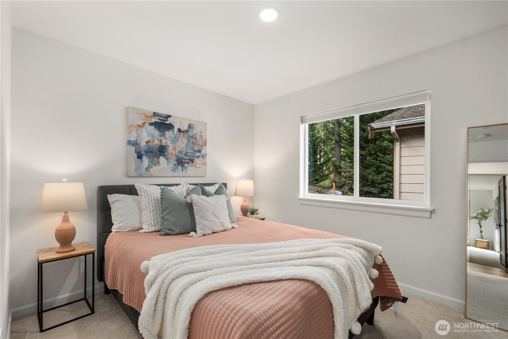 11127 Northeast 162nd Street Bothell, WA 98011 - Photo 27 of 40 a bedroom with a bed and a painting on the wall