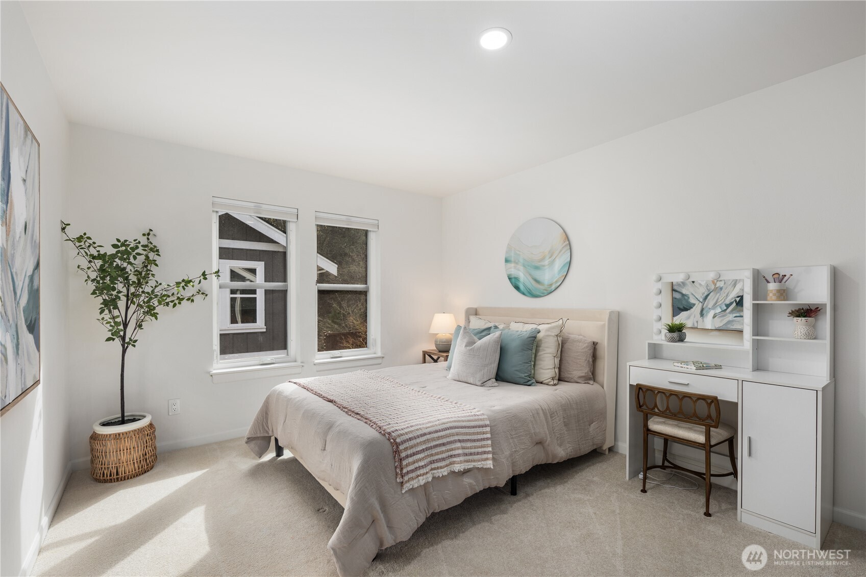 11127 Northeast 162nd Street Bothell, WA 98011 - Photo 28 of 40 a bedroom with a bed and a potted plant