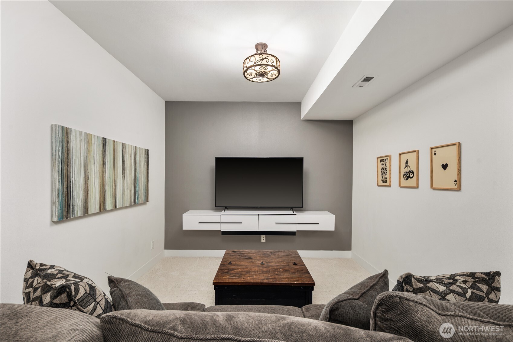 11127 Northeast 162nd Street Bothell, WA 98011 - Photo 31 of 40 a living room with furniture and a flat screen tv