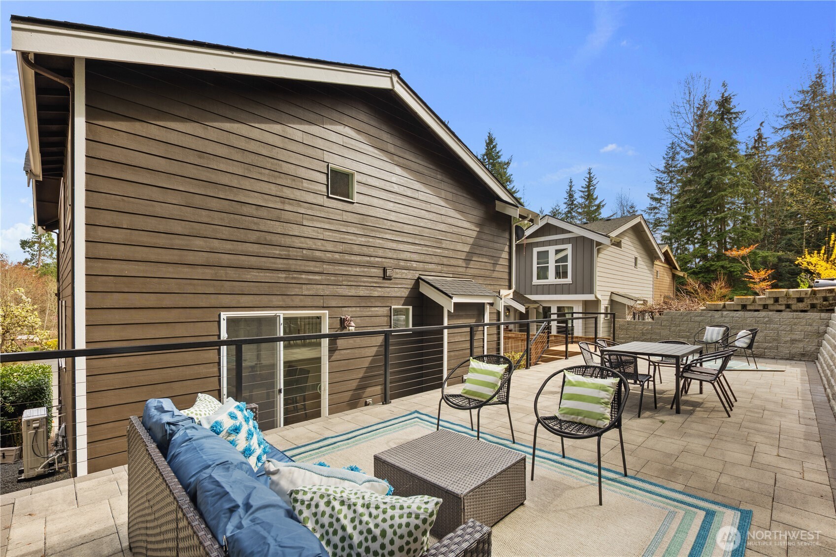 11127 Northeast 162nd Street Bothell, WA 98011 - Photo 34 of 40 a view of a patio with couches table and chairs and potted plants