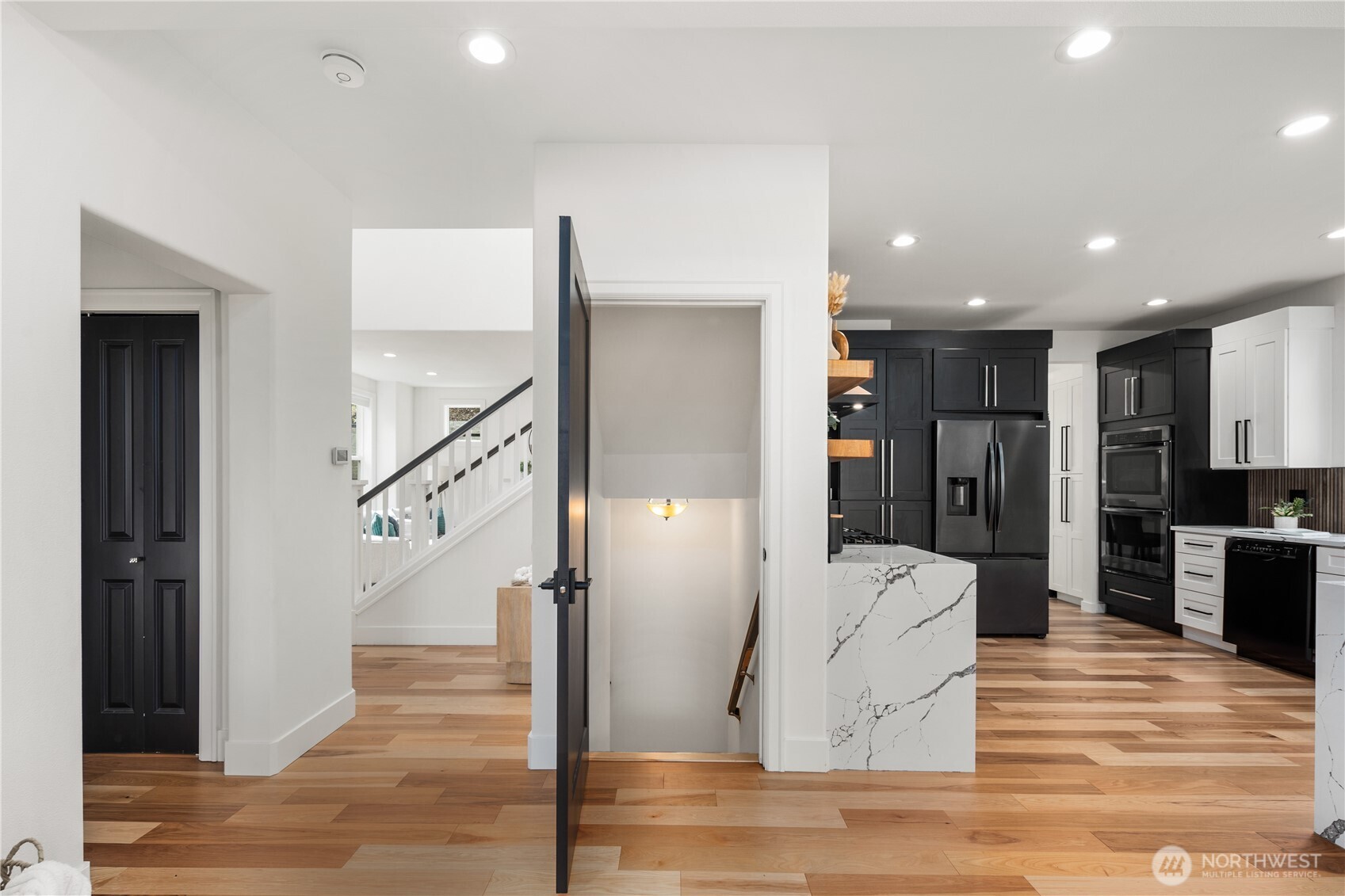11127 Northeast 162nd Street Bothell, WA 98011 - Photo 4 of 40 a view of entryway and hall with wooden floor